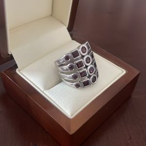 Sterling silver ring with garnet colored gems